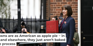 The obligatory showing of the red briefcase containing budget details is as exciting as it gets in the U.K. Justin Tallis - WPA Pool/Getty Images